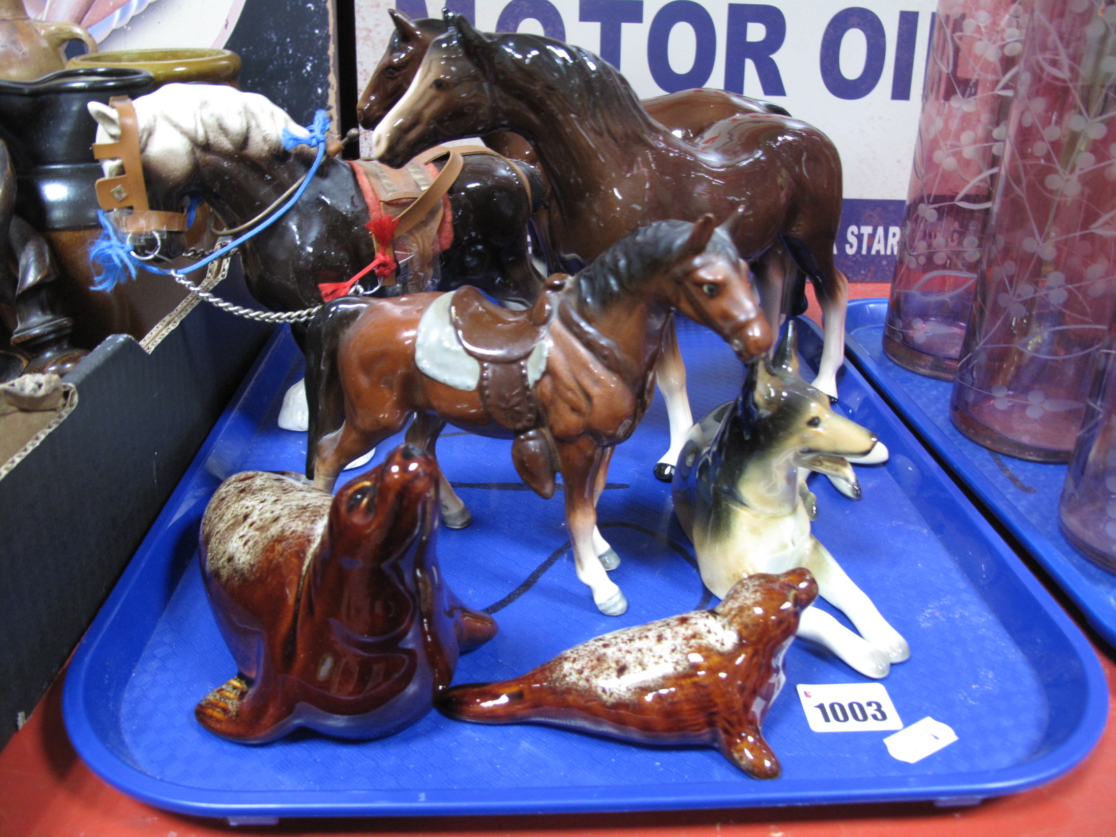 A Melba Ware Horse, further brown horse, shirehorse, seated alsatian, fosters seals:- One Tray