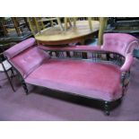 An Edwardian Mahogany Chaise Longue, with upholstered rail turned supports, on turned feet.