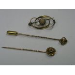 Charles Horner; An Openwork Bar Brooch, with cabochon highlight, within swirl design border;