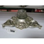 A Decorative Inkwell, of shaped design, allover detailed in relief with removable glass well,