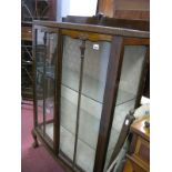 A 1920's Mahogany Display Cabinet, with a low back, glazed doors on cabriole legs.