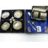 A Set of Four Hallmarked Silver Shell Salts, in original fitted case with spoons, napkin rings.