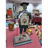 A XIX Century Style Painted Spelter American Figure, of a man with a clock face mounted on his