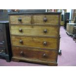 A XIX Century Mahogany Chest of Drawers, with a low back, two small drawers, three long drawers,
