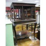 An Early XX Century Mahogany Table Bookcase, with spindle slats to revolving upper compartment on