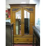 A Late XIX Century Satin Walnut Double Wardrobe with reeded and stepped pediment, twin hanging