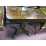 A XIX Century Mahogany Tea Table, with a fold over top, octagonal shaped pedestal on paw feet