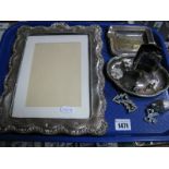 A Hallmarked Silver Mounted Rectangular Photograph Frame, (damages) a match box stand on dish,