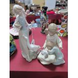 Two Lladro Models 'Little Sister' (1534) and 'Girl Feeding a Goose'. (2)