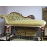 A XIX Century Mahogany Chaise Longue, with shaped top rail, with button back upholstery, on turned