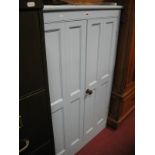 A Painted Pine Cupboard, two panel doors, with (later fitted) interior adjustable shelving.