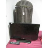 A 1930's Lloyd Loom Lusty Cylindrical Linen Basket, domed lid and a 22" LG Flatscreen TV with remote