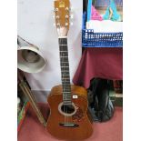 A Hondo Model H124 Acoustic Guitar.