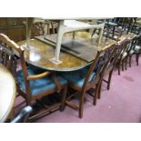 A XX Century Walnut Twin Pedestal Table with a burr walnut top, turned pedestal's on carved cabriole