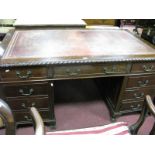 An Early XX Century Mahogany Pedestal Desk, with a leather insert, gadrooned edge, three top