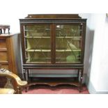 A 1920's Mahogany Display Cabinet, with blind fret work frieze and sides, astragl glazed doors on