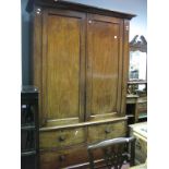 A XIX Century Mahogany Wardrobe, with stepped pediment, sliding trays to left section, hanging