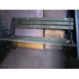 A Two Seater Garden Bench, cast iron scrolled ends.