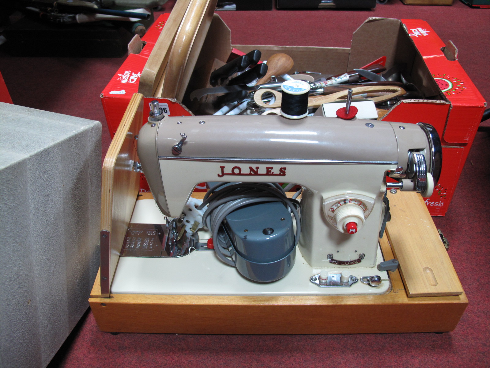 One Box Quantity of Cutlery, Jones electric sewing machine, (Untested: sold for parts only).