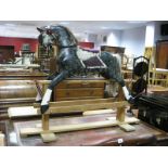 Dapple Coloured Rocking Horse, with haired mane and tail, maroon fabric saddle on stripped wooden