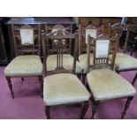 A Set of Edwardian Salon Chairs, with a shaped top rail, upholstered back panel and seat, on