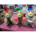Three Musical Gold Plush Monkeys, with key wind mechanism, approximately 21cm high.
