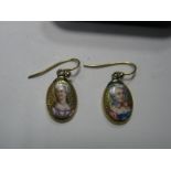 A Pair of Enamel Miniature Style Drop Earrings, depicting female profiles.