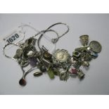 A Curb Link Charm Bracelet, suspending numerous charms, including six pence in a mount and other