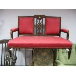 An Edwardian Mahogany Inlaid Salon Settee, the back with a pierced splat, upholstered panels, seat