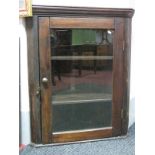 A XX Century Pine Corner Cupboard, with a stepped pediment glazed door, two internal shelves.