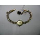 Sovereign; A 9ct Gold Cased Ladies Quartz Wristwatch, to integral 9ct gold gate style bracelet,