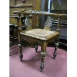 A XIX Century Oak Corner Chair, the top with carved fruit, shaped arms, carved splats, leather seat,