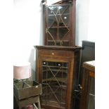 A XIX Century Mahogany Corner Cupboard, with a glazed astragal door; Early XIX Century Mahogany