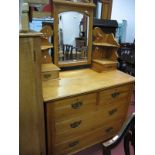 An Early XX Century Satin Walnut Dressing Table, with a central mirror, jewel drawers, two short