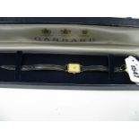 Garrard; A Modern 9ct Gold Cased Ladies Wristwatch, the signed rectangular dial with line markers,