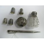 A Hallmarked Silver "Isle of Man" Souvenir Thimble, three further thimbles, a Yard O Led engine