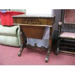 A Late XIX Century Oak Sewing Table, with carving in the Gothic manner, to moulded border and apron,