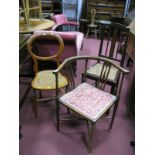 An Edwardian Corner Chair, with shaped arms, upholstered seat, with a 'X' stretcher, turned legs