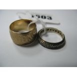 A Wide 9ct Gold Wedding Band Ring, of floral design, another similar. (2)