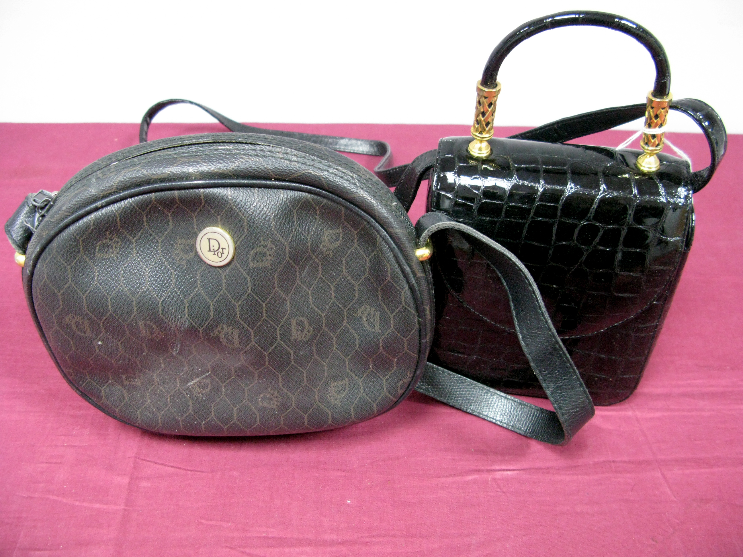 Dior; A Vintage Black Logo Print Shoulder Bag, with black leather strap and zip closure to top; A