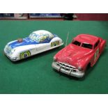 A 1950's Plastic Police Car, by Marx, friction drive, red plastic, 24cm long, plus a tinplate police