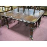 A XIX Century Mahogany Wind-Out Dining Table, on turned and reeded legs (no leaves), 74cm high,