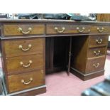 An Early XX Century Mahogany Kneehole Desk, with three top drawers, two pedestals with three