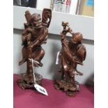 A Pair of Chinese Carved Hardwood Figures, of wise old men, the highest 23.5cm