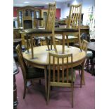 A Set of Six G Plan Teak Rail Back Dining Chairs, together with extending circular topped dining