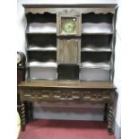 A XVII Century Style Oak Dresser, the rack with brass dial engraved 'Poulton Tuddington', the base