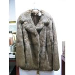 A Ladies Three Quarter Length Mid Brown Coney Fur Jacket.