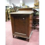 An Edwardian Inlaid Mahogany Purdonium with a low back, fall front panelled door, on tapering