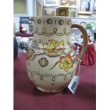 A Charlotte Rhead Jug, tube lined decoration of flowers and foliage on a cream ground, base