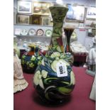 A Modern Moorcroft Pottery Vase, of baluster form, painted in the 'Orchid Arabesque' pattern against